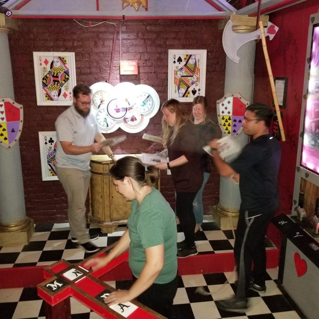 People playing escape room game.